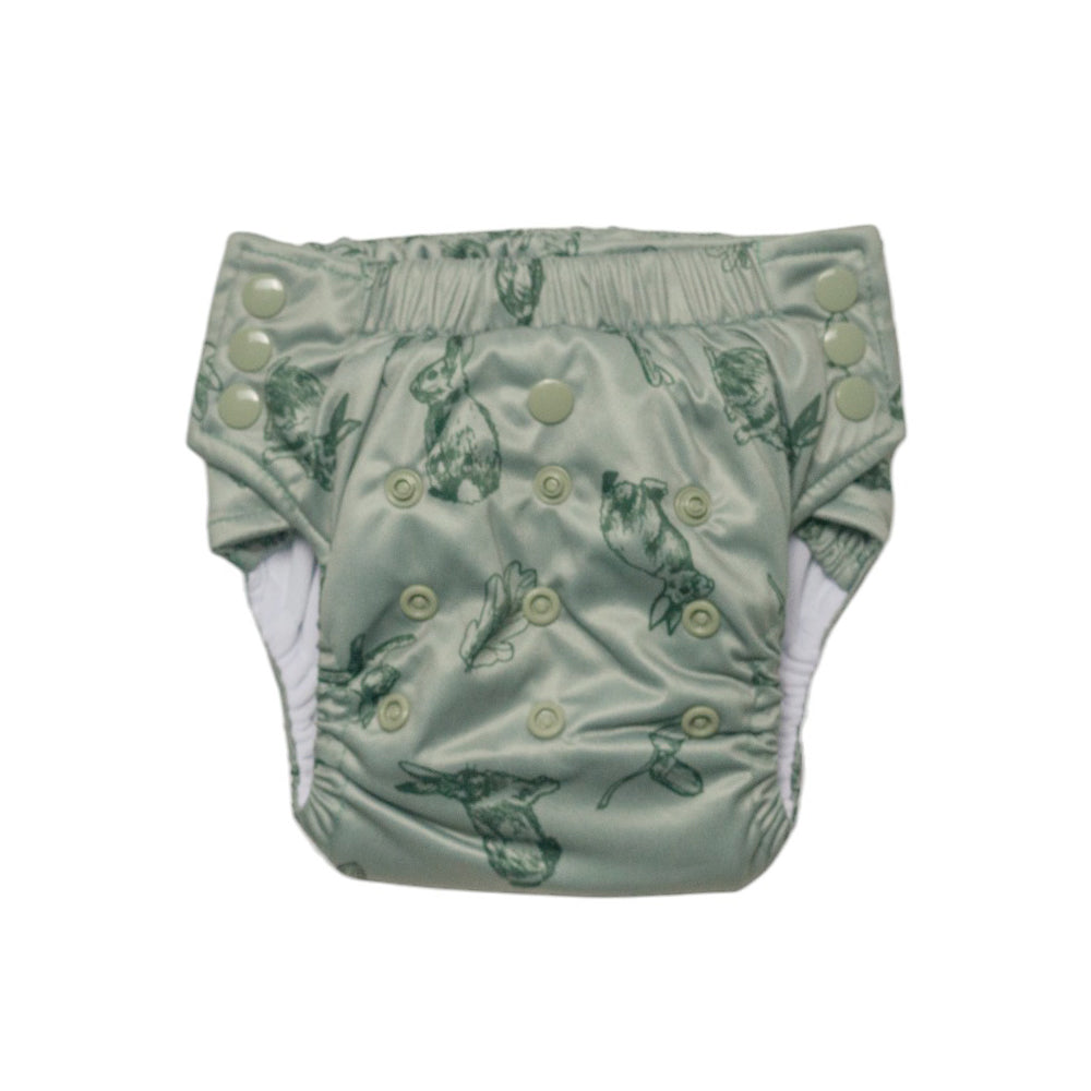 Reusable toddler pull-up style nappy with a sage rabbit pattern on a white background