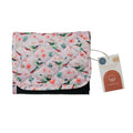 Floral-patterned change purse with a tag on a white background