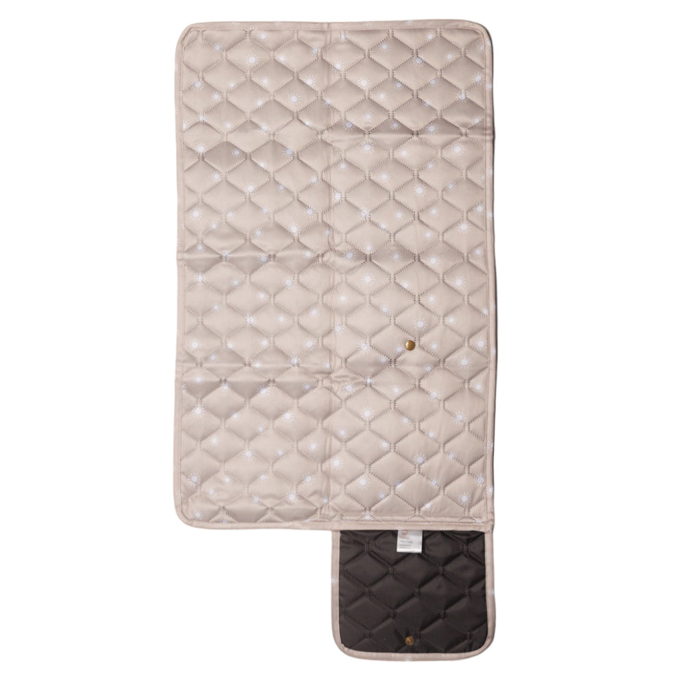 Nestling quilted waterproof change mat with beige sunshine pattern on a white background