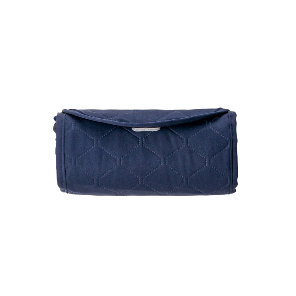 A navy blue quilted kids play mat with a diamond pattern, shown rolled up on a plain white background.