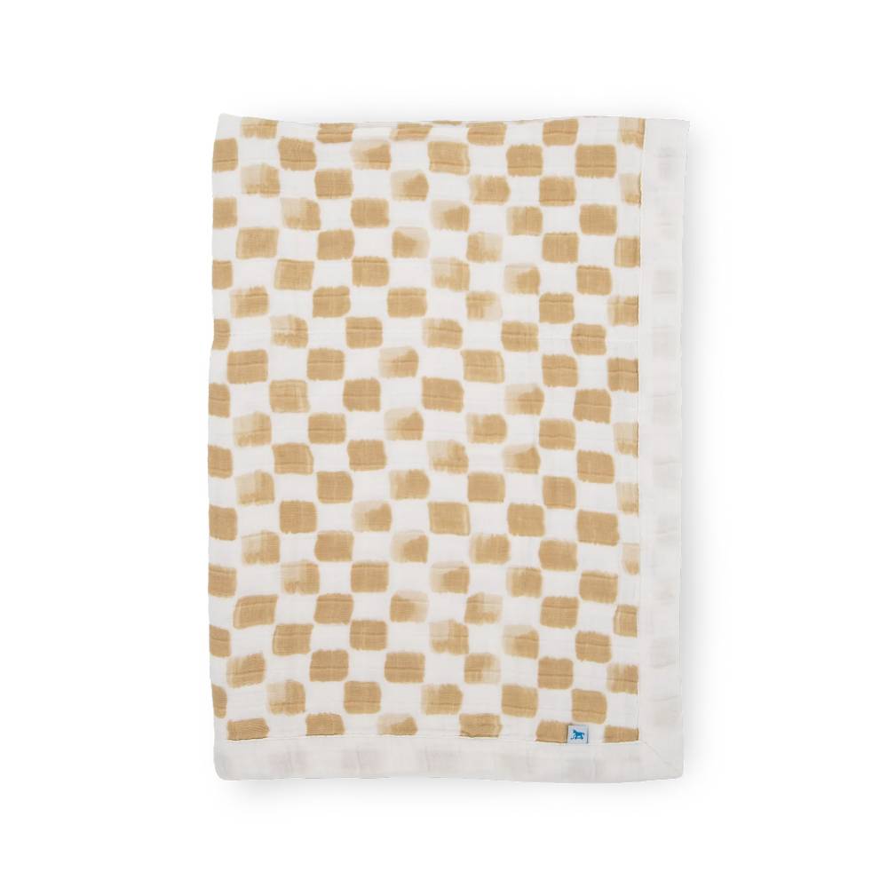Checkered beige and white cotton muslin baby blanket on a white background