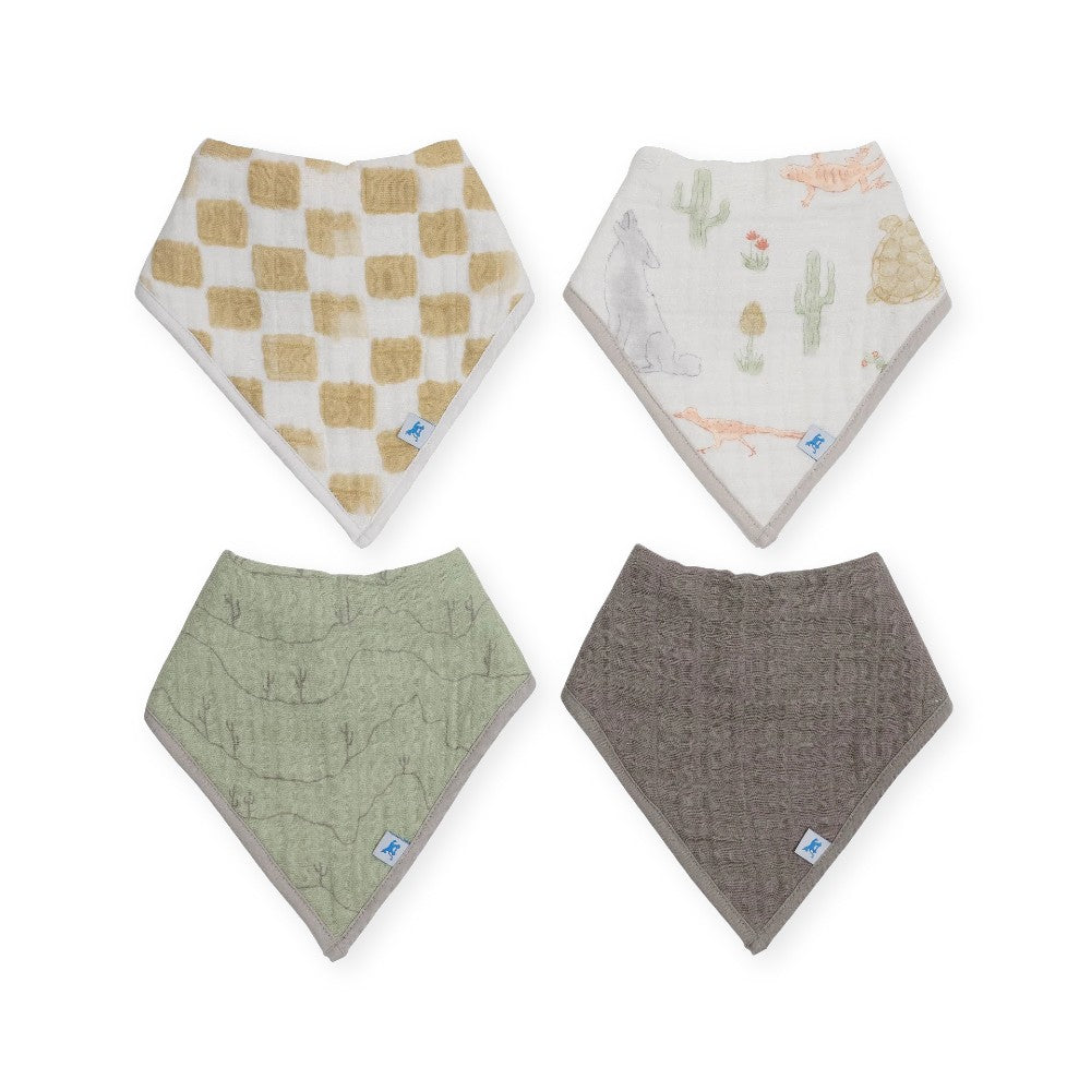 Four cotton muslin baby bandana bibs with beige and white check, white desert pattern, green desert pattern and dark grey on a white background