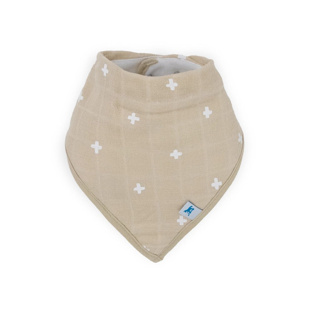 Beige baby bandana bib with white cross patterns and little unicorn brand logo on a white background