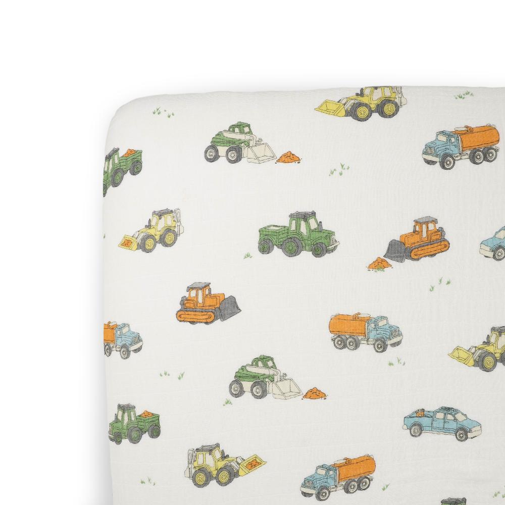 Cotton muslin fitted sheet white with colorful truck pattern on a white background