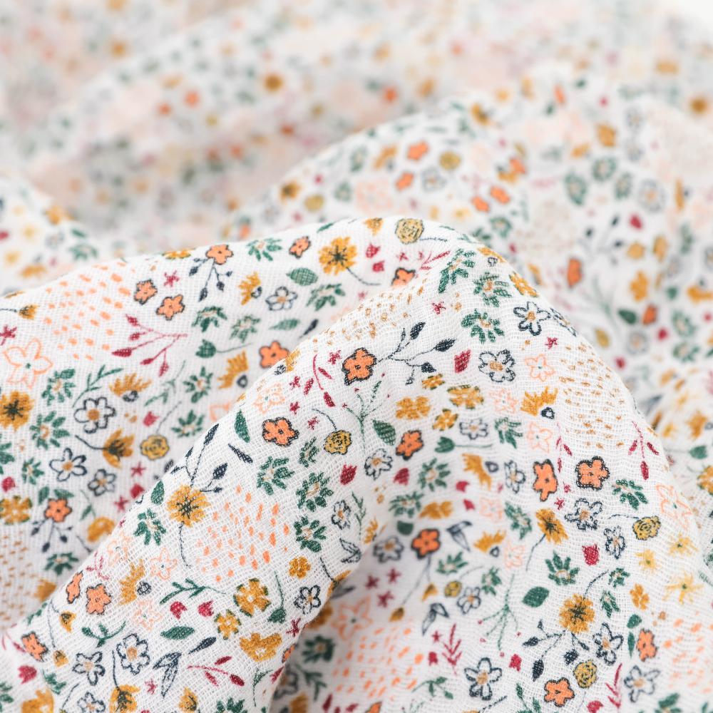 Close-up of floral-patterned fabric with a soft texture