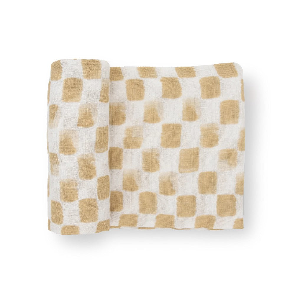 A white and beige checkered cotton muslin swaddle blanket on a white background