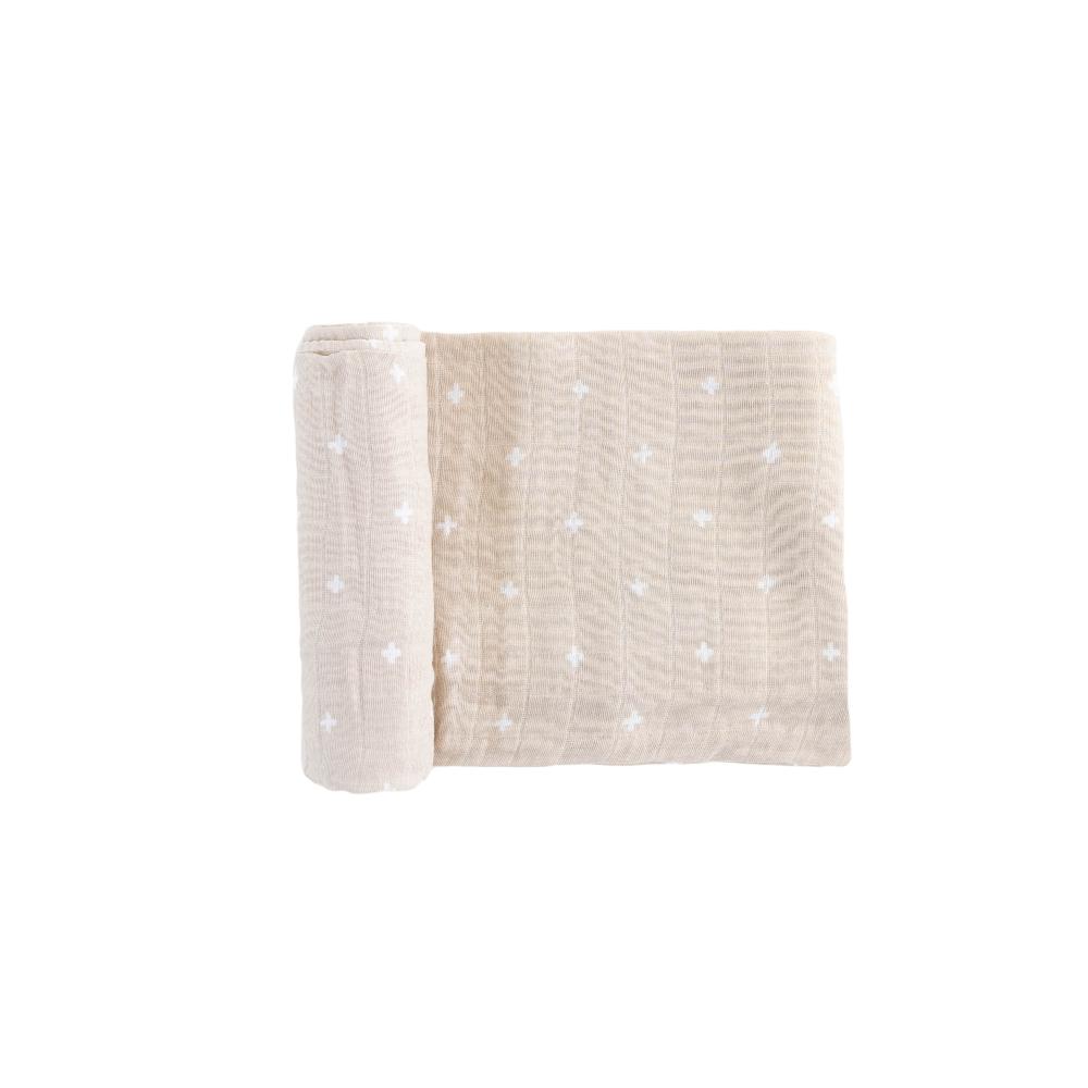 Beige textured muslin fabric swaddle
 with cross patterns on a white background