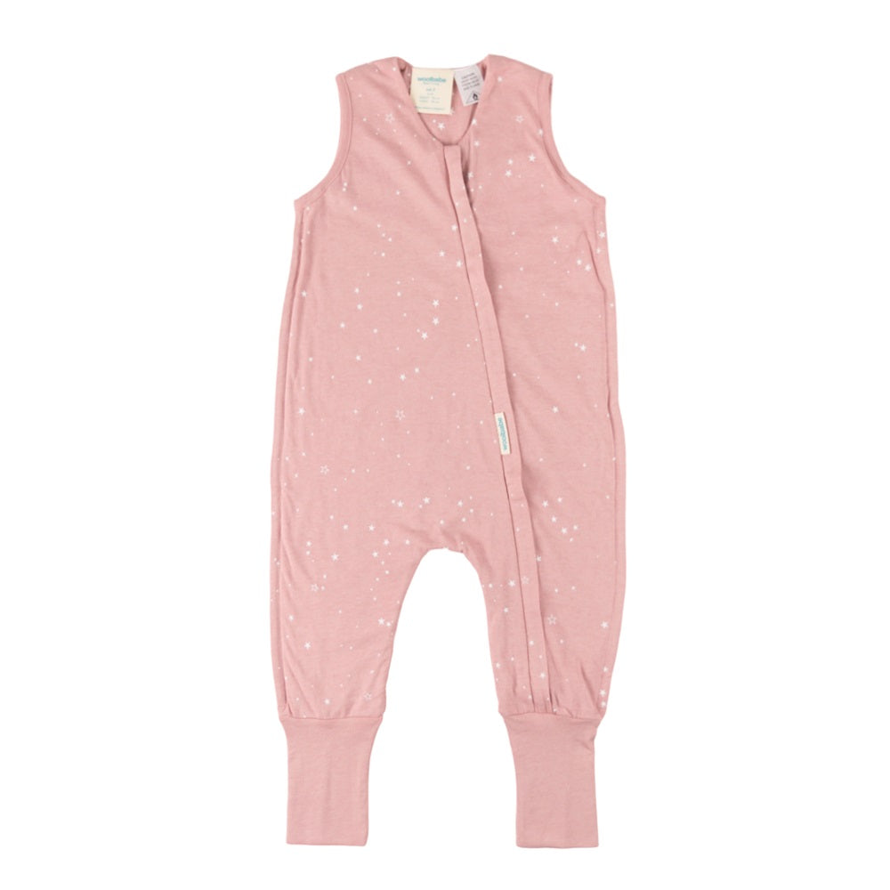 Pink toddler sleep onesie with white star pattern on a white background