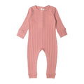 Pink baby woolbabe onesie on a white background