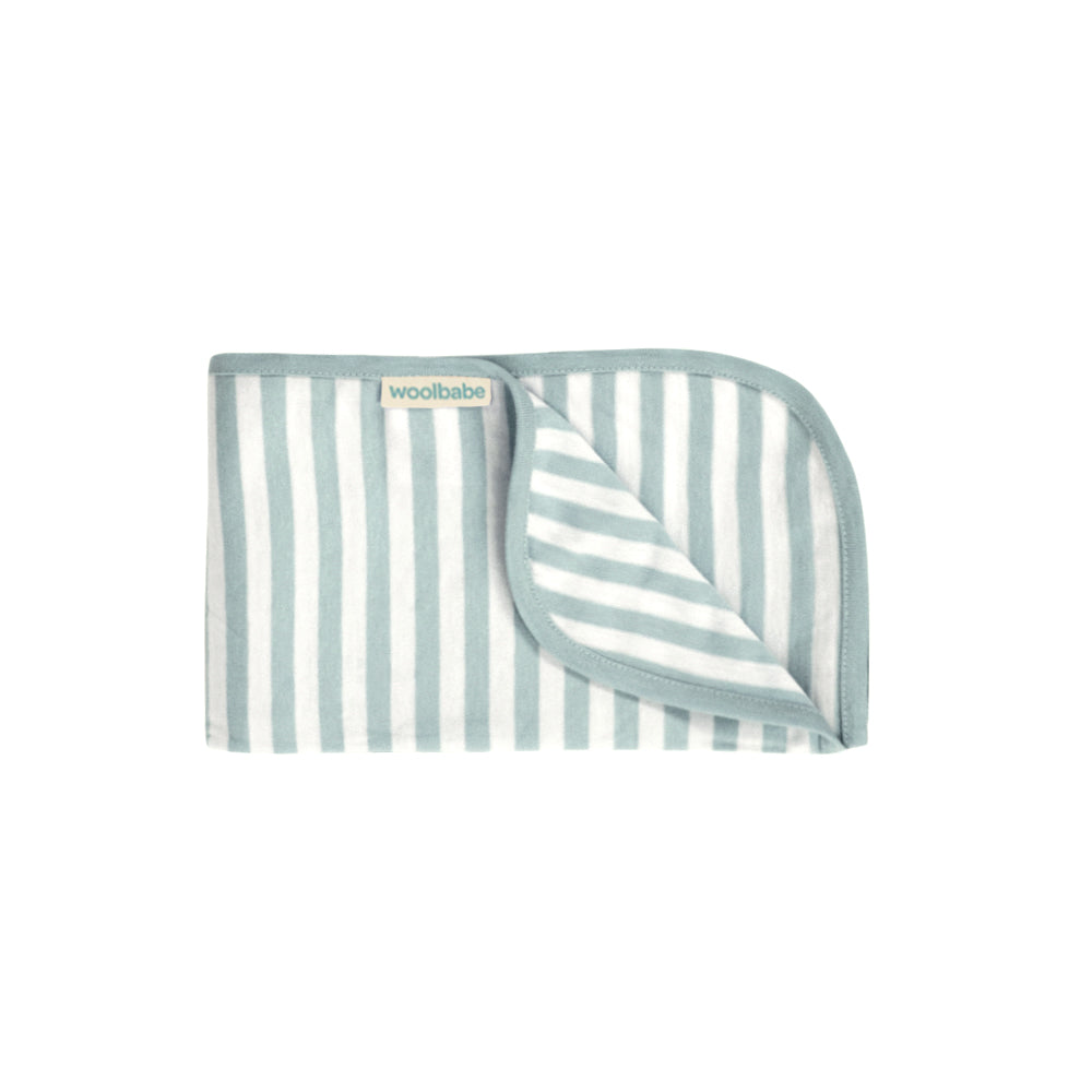 Striped baby blanket with 'woolabebe' branding on a white background