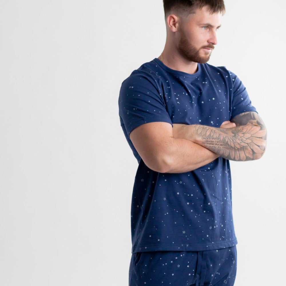 woolbabe navy blue Tshirt worn on a muscular man with tattoos