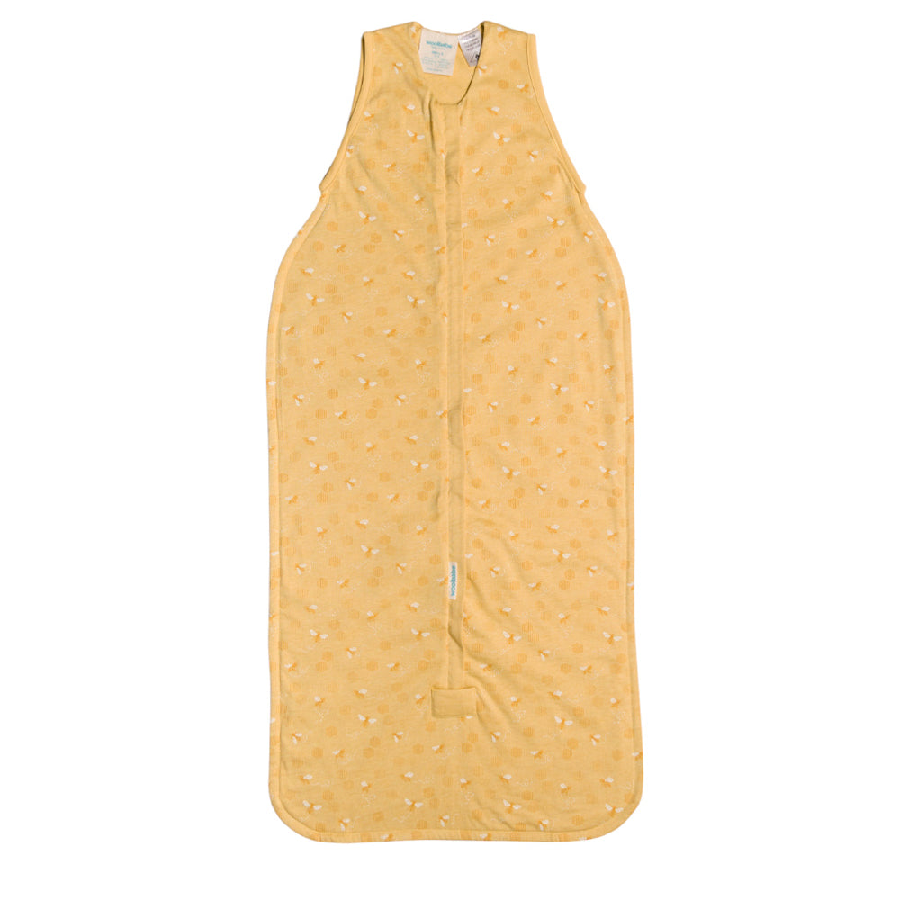 Yellow baby sleeping bag with a subtle bee pattern on a white background