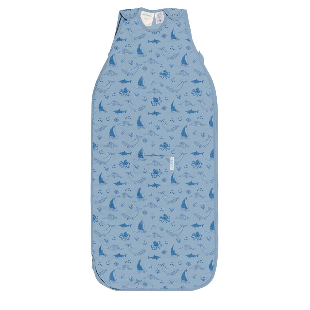Blue woolbabe baby sleeping bag with sea creature pattern on a white background