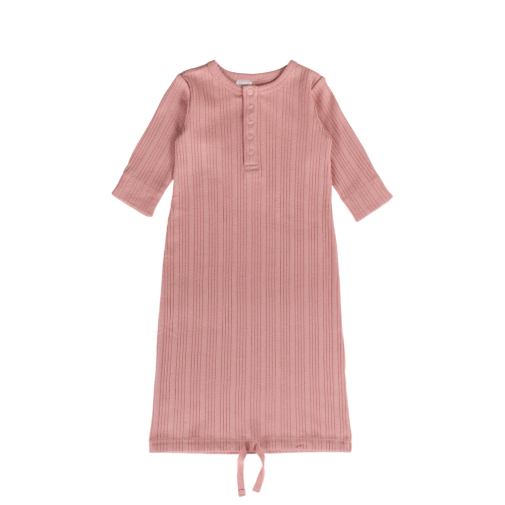 Pink ribbed woolbabe gown with a tie at the bottom on a white background