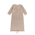 Beige ribbed merino baby gown with long sleeves on a white background