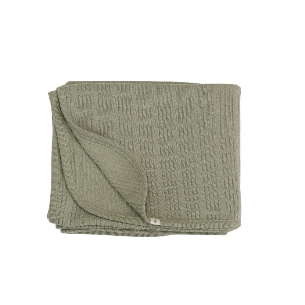 Folded green blanket on a white background