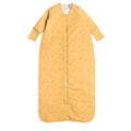 Yellow baby sleeping bag with a subtle pattern on a white background