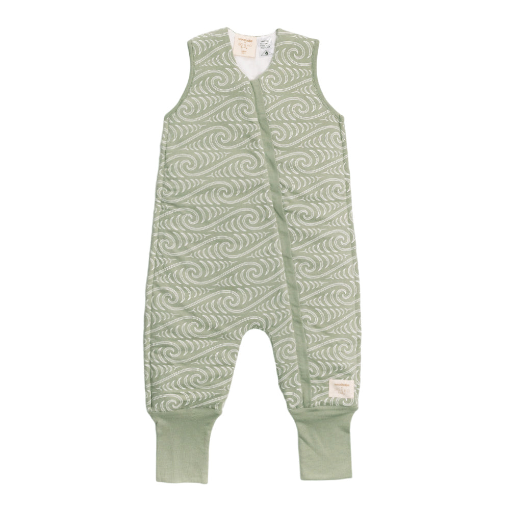 Toddler sleepsuit with Maori wave pattern on a white background