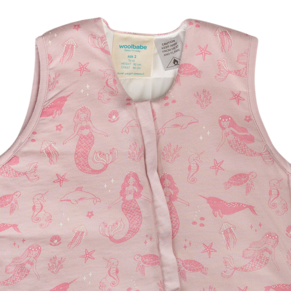 Pink children's vest with mermaid pattern on a white background