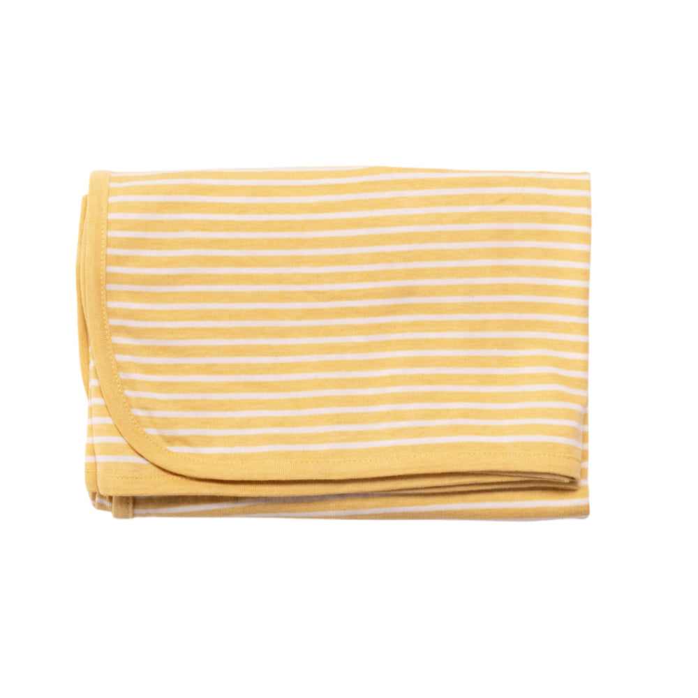 Yellow and white striped blanket on a white background