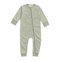 Baby onesie with Maori wave pattern on a white background