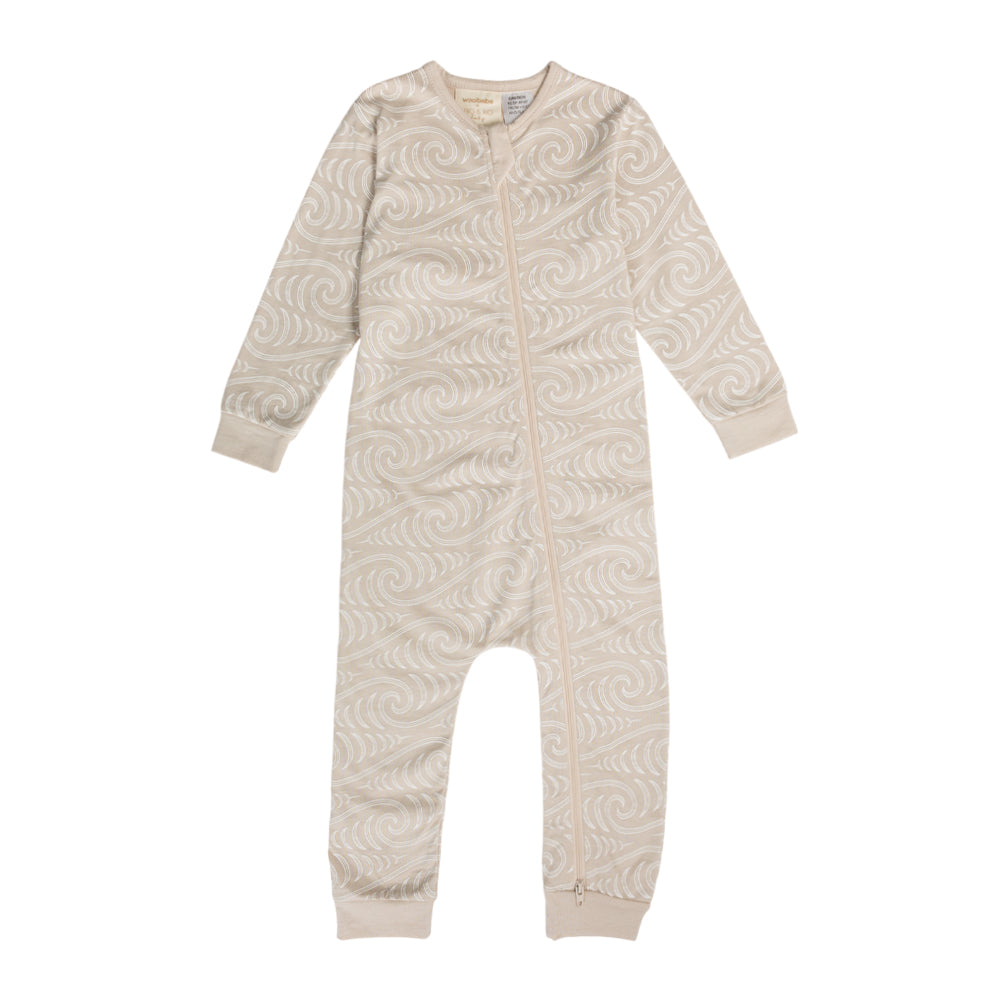 woolbabe onesie with maori wave design on white background
