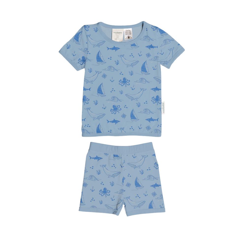 Children's blue pajama set with sea-themed pattern on a white background