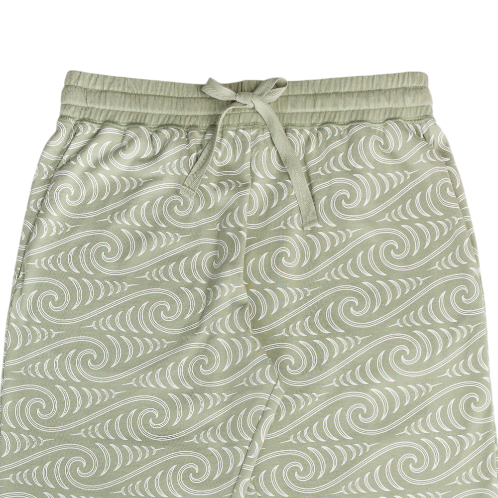 Light green Maori patterned lounge pyjama pants on a white background