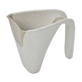 A modern beige plastic jug with a curved handle and angled opening, shown on a plain white background.