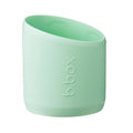 Light green silicone bumper with 'b.box' branding on a white background