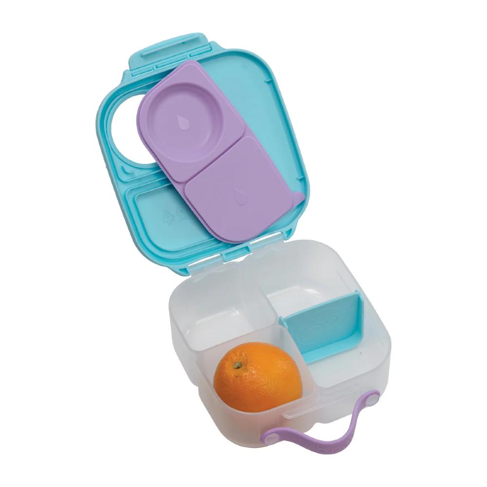 Colorful  mini lunchbox with an orange inside on a white background