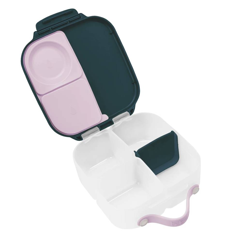 Navy mini lunchbox compartmentalized container with pink interior on a white background
