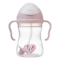 Pink sippy cup with Minnie Mouse design on a white background
