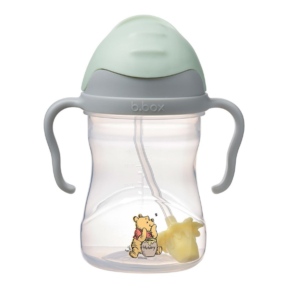 Sippy cup with Winnie the Pooh design on a white background