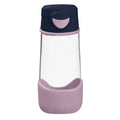 Clear glass water bottle with navy and pink lid and base on a white background