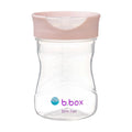 Clear sippy cup with pink lid and b.box logo on a white background