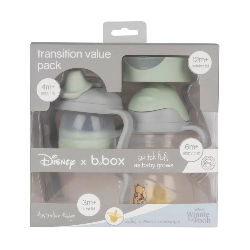 A packaged trial pack of sippy cups with a Winnie the Pooh design on a white background. 