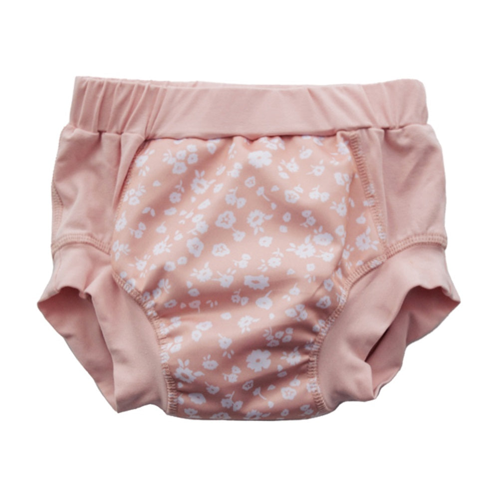 Pink training pants with white daisy  pattern on a white background