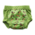 Green training pants with construction vehicle pattern on a white background