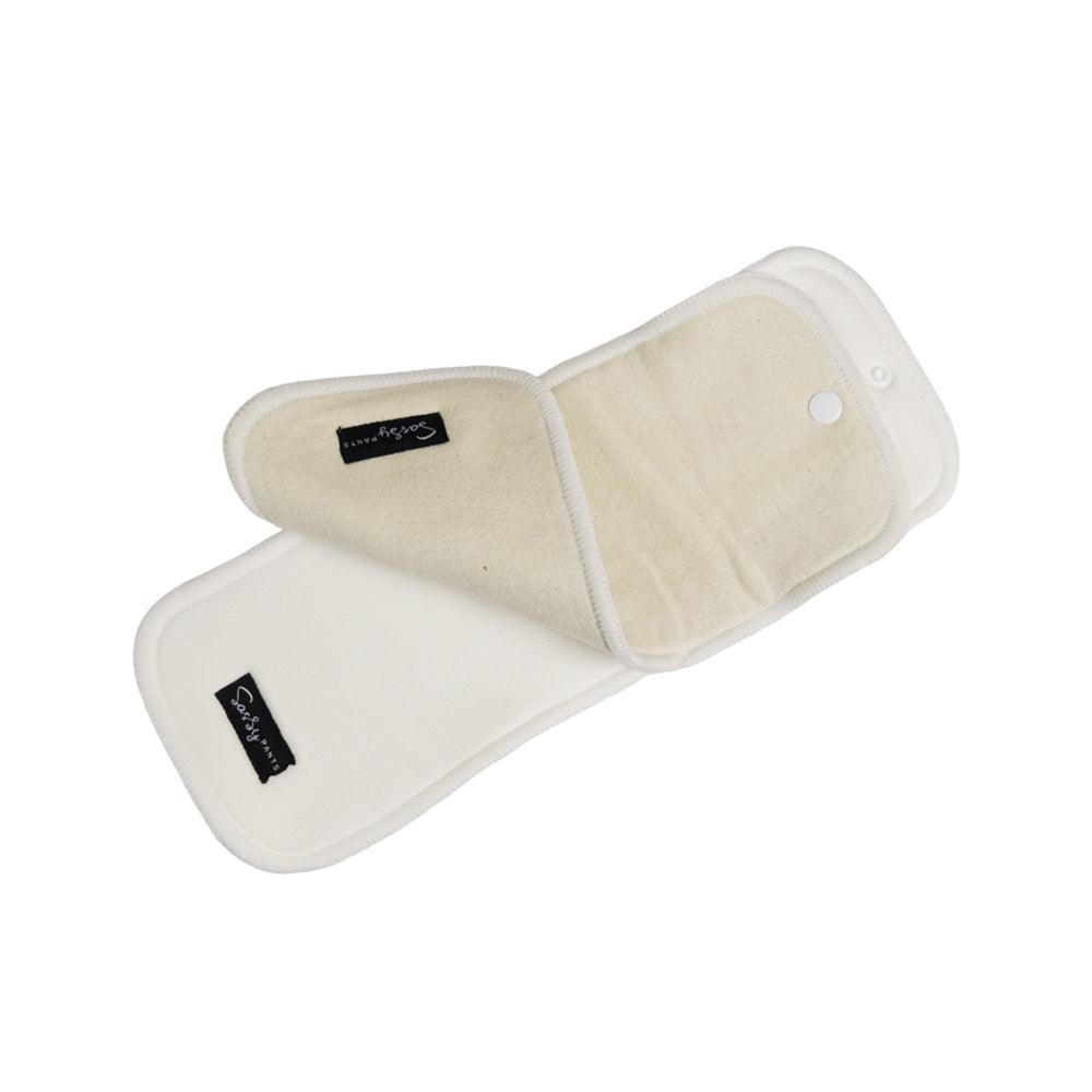 Pair of Nestling Straight Up Nappy Pants reusable cloth inserts with beige interior on a white background