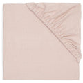 A folded light pink cotton sheet with a ribbed elasticated corner, shown on a clean white background.