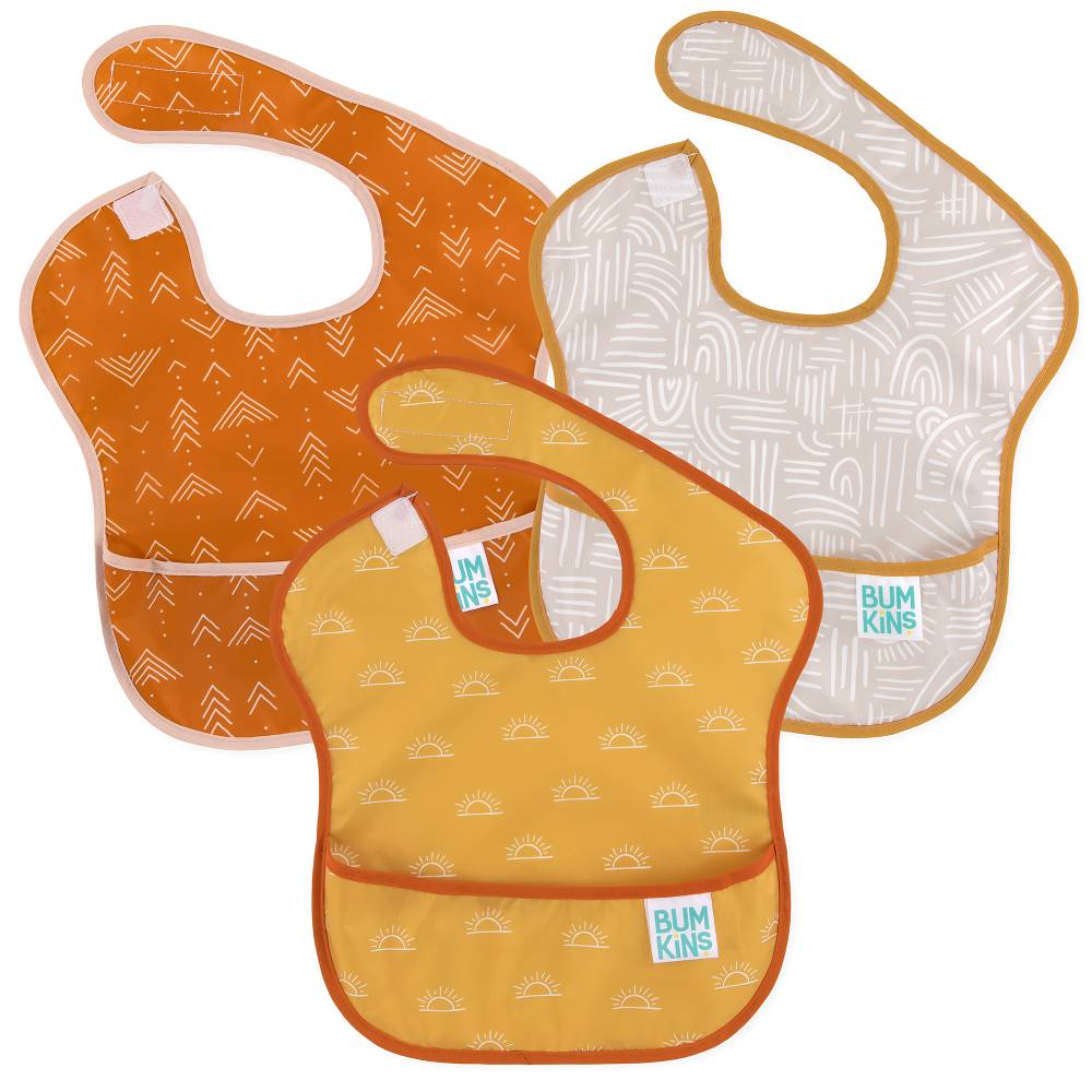 3 waterproof Bumkins bibs in 3 yellow & orange patterns on a white background