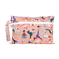 A light pink Wet and dry clutch with pictures of women and dogs in Yoga poses and a visible brand tag on a white background