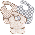3 waterproof Bumkins bibs in 2 check prints and a palm print on a white background