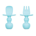 An aqua blue set of silicone baby cutlery chewtensils including one spoon and one fork with bumkins logo on the handle 
