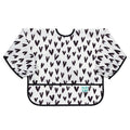 a long sleeved waterproof bib with elasticated wrists and front pocket in a white with black heart pattern, black piping and a bumkins tag