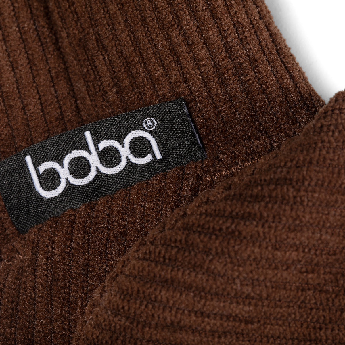 Close-up of a brown textured fabric with a 'boba' label.