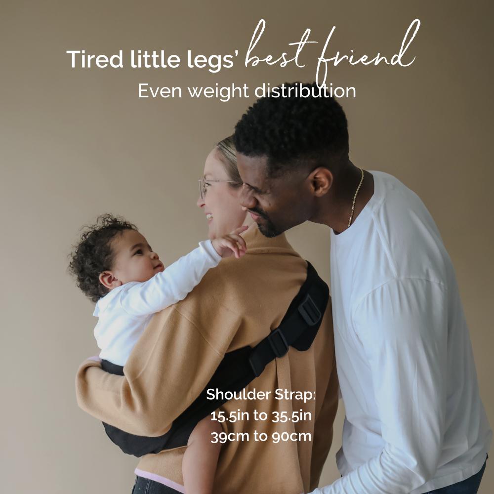 Person holding a child in a carrier assist hip carrier with text about weight distribution and shoulder strap length.