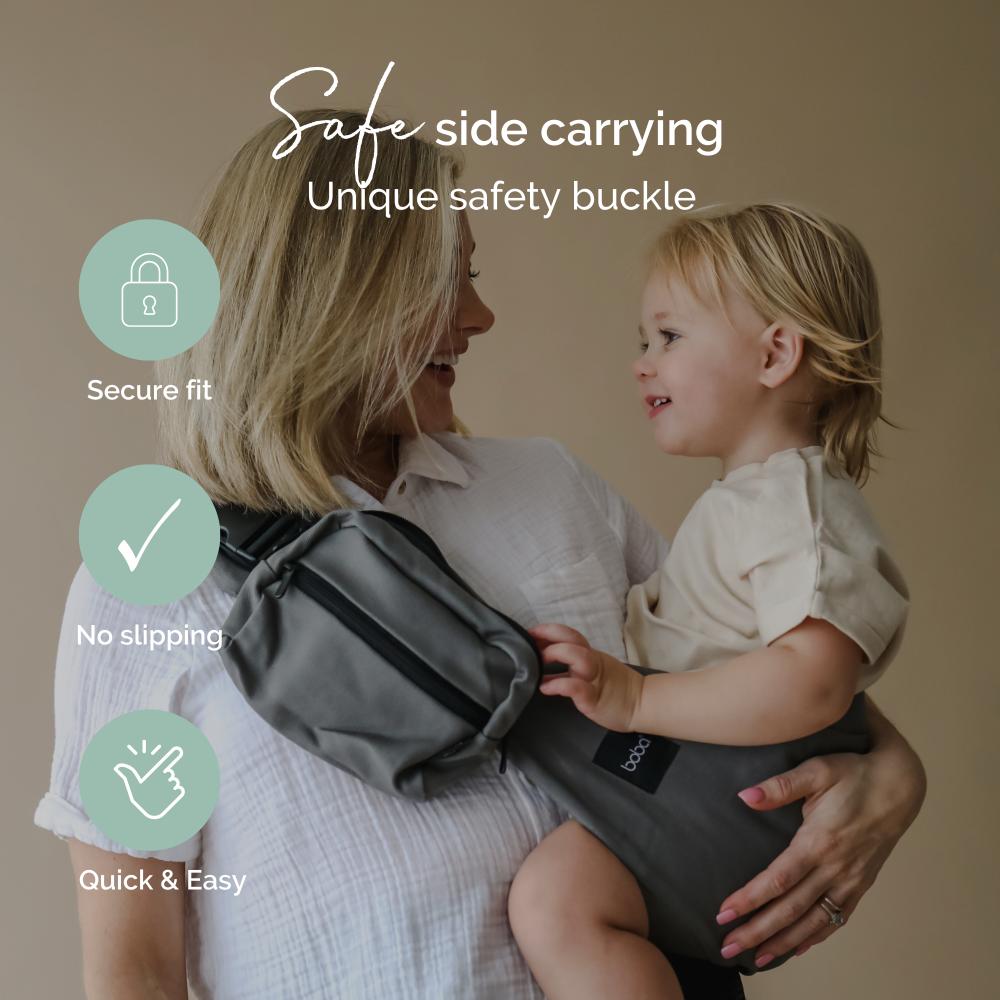 Woman holding a child using a baby carrier with text highlighting safety features.