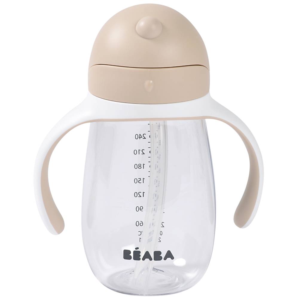 A clear plastic baby sippy cup with integrated white handles, a beige lid, and a beige side grip, featuring the BEABA brand name printed in black at the bottom.